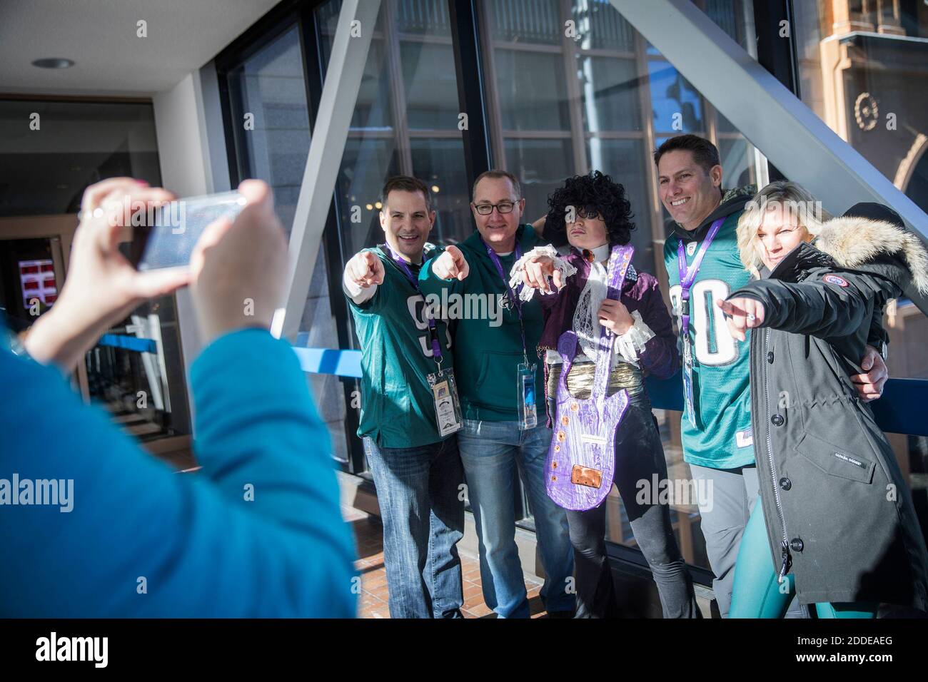 NO FILM, NO VIDEO, NO TV, NO DOCUMENTARY - Eagles fans from Philadelphia Matt Ryan, from left, John Ford, Jim Godorecci and Kari Godorecci pose for a photo with Prince impersonator Andrew Anderson, center, in the skyway over Nicollet Mall Sunday, Feb. 4, 2018 in Minneapolis, Minn. Photo by Lelia Navidi/Minneapolis Star Tribune/TNS/ABACAPRESS.COM Stock Photo