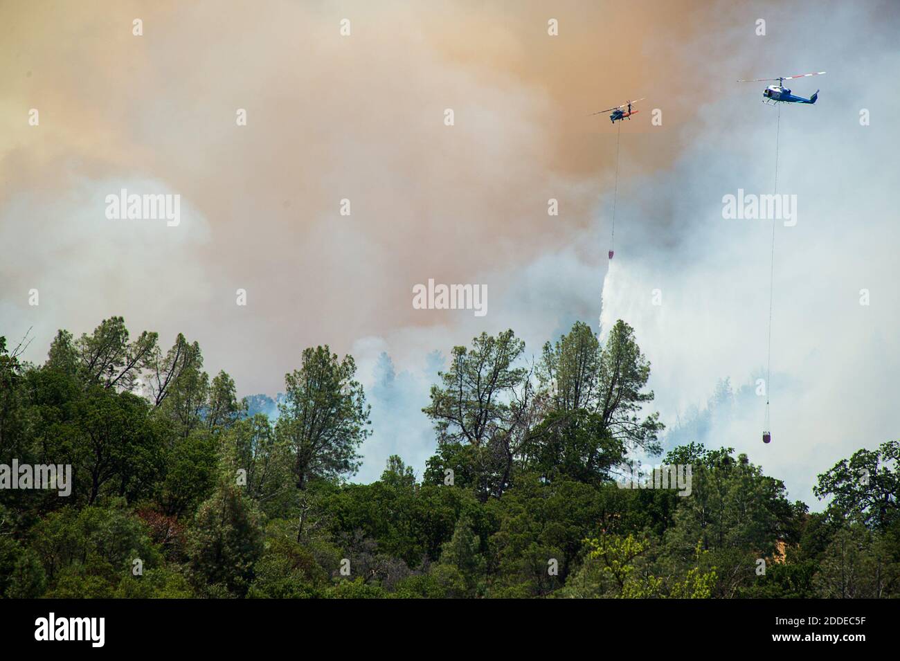 NO FILM, NO VIDEO, NO TV, NO DOCUMENTARY - Helicopters drop water, attacking the County Fire, which has burned more than 22,000 acres without containment, on Sunday, July 1, 2018 in Capay Valley, CA, USA. Photo by Paul Kitagaki Jr./Sacramento Bee/TNS/ABACAPRESS.COM Stock Photo