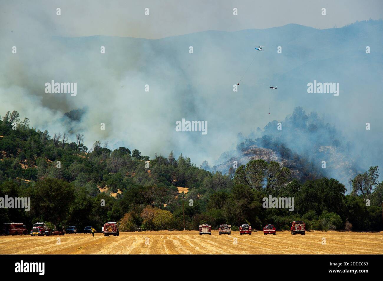NO FILM, NO VIDEO, NO TV, NO DOCUMENTARY - Helicopters drop water, attacking the County Fire, which has burned more than 22,000 acres without containment, on Sunday, July 1, 2018 in Capay Valley, CA, USA. Photo by Paul Kitagaki Jr./Sacramento Bee/TNS/ABACAPRESS.COM Stock Photo