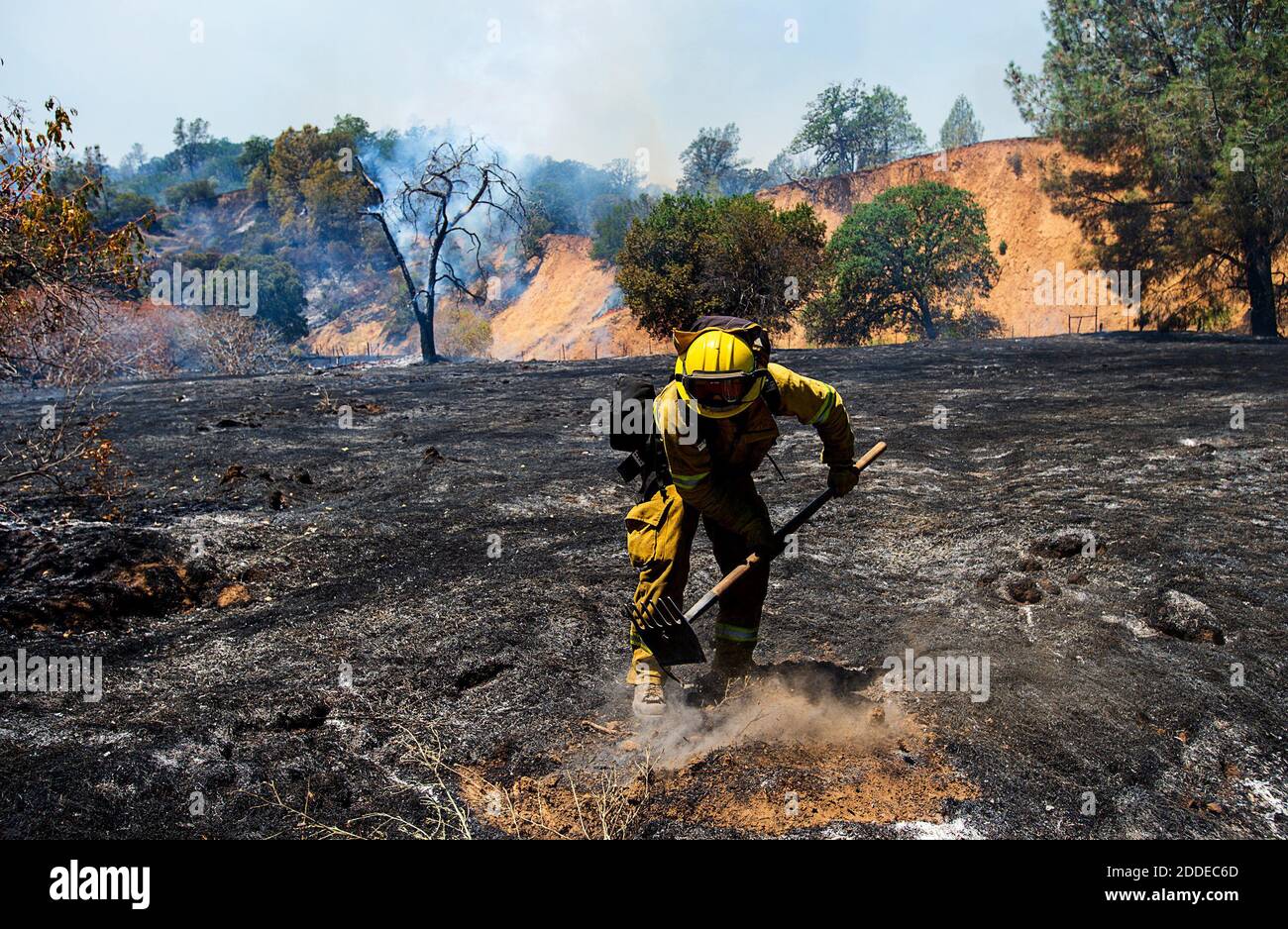 NO FILM, NO VIDEO, NO TV, NO DOCUMENTARY - Jack Miguel of the Keyes Fire Department attacks a hot spot during the County Fire, which has burned more than 22,000 acres without containment, on Sunday, July 1, 2018 in Capay Valley, CA, USA. Photo by Paul Kitagaki Jr./Sacramento Bee/TNS/ABACAPRESS.COM Stock Photo