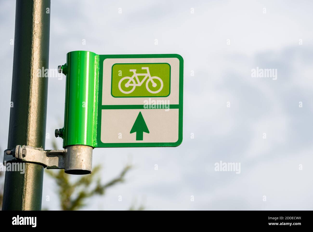 Directional sign along a bicycle path. Copy space. Stock Photo