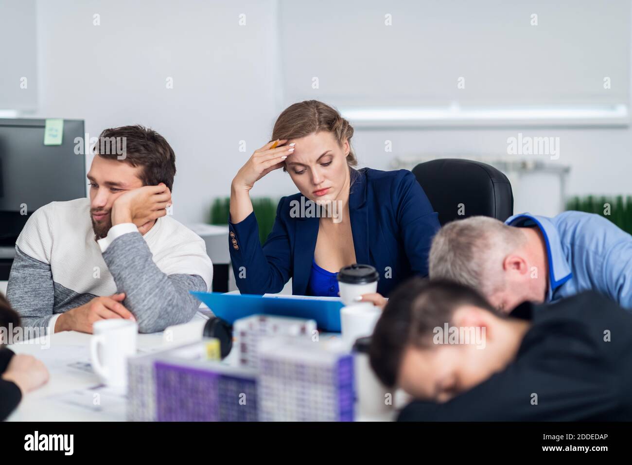 Businessman sleeping during meeting in hires stock photography and