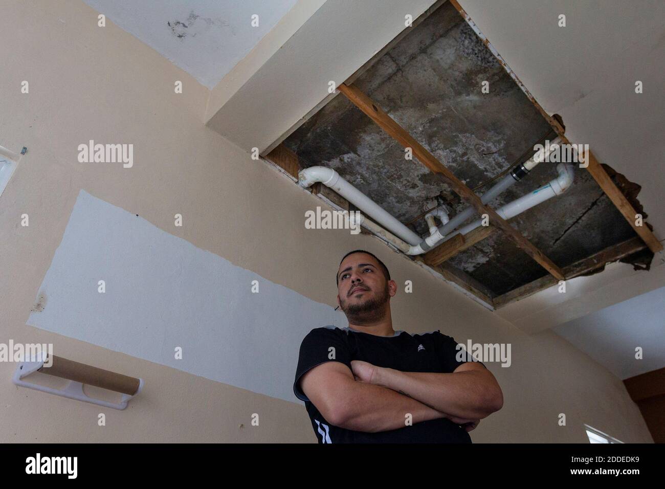 NO FILM, NO VIDEO, NO TV, NO DOCUMENTARY - Waldemar Rosado, 28, stands under the partially collapsed roof of his kitchen in the La Juncia community in Comerio, Puerto Rico on August 25, 2018. Rosado and his family are unable to live in the home, which was severely damaged during Hurricane Maria last year. Photo by Matias J. Ocner/Miami Herald/TNS/ABACAPRESS.COM Stock Photo
