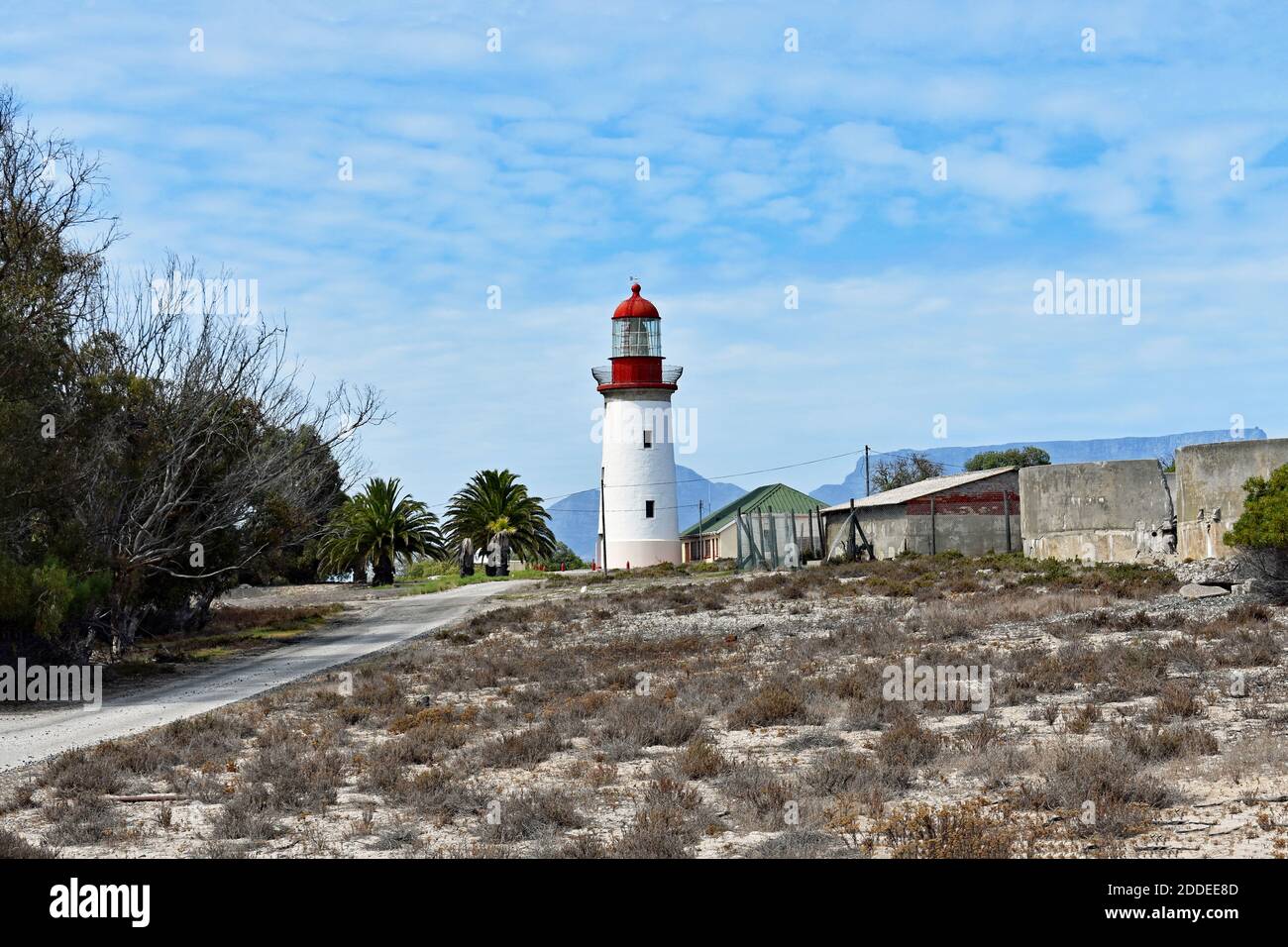 The lighthouse on Robben Island, Caoe Town, South Africa. Table Mountain can be seen behind the lighthouse across Table Bay. Stock Photo