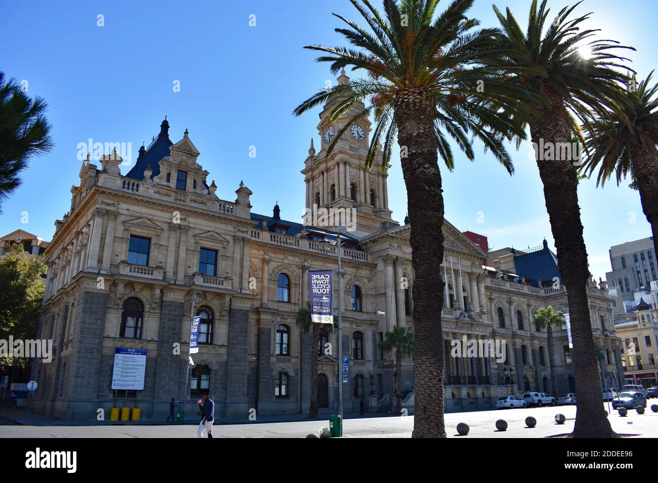 A view of Cape Town City Hall taken from the Grand Parade.  Palm trees line the edge of the public square.  Cape Town, South Africa. Stock Photo