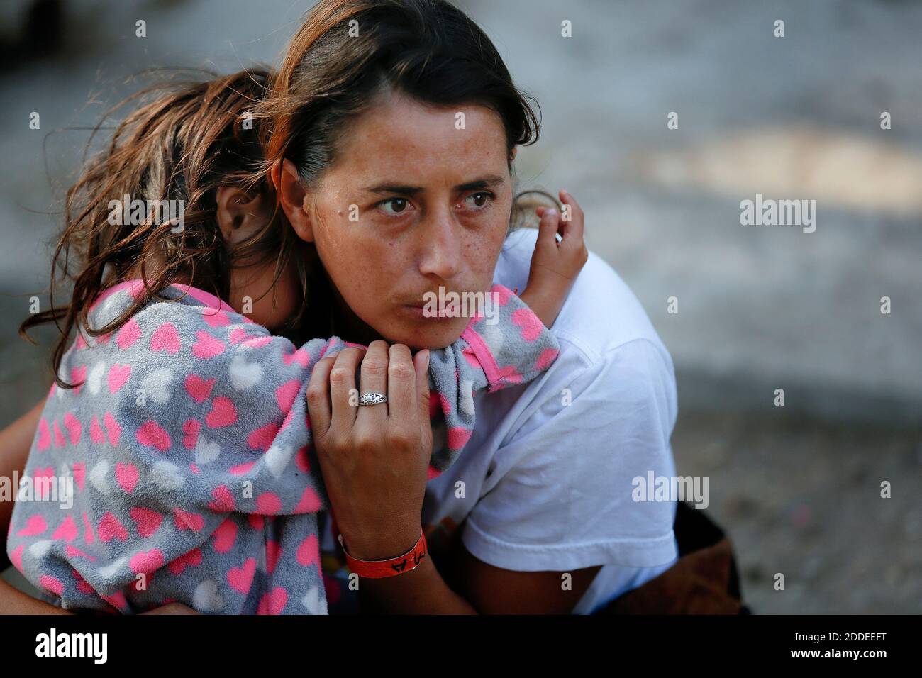 NO FILM, NO VIDEO, NO TV, NO DOCUMENTARY - A woman and her daughter wait just outside the temporary shelter set up at Unidad Benito Juarez in Tijuana where refugees are temporary sheltered. Photo by Nelvin C. Cepeda/San Diego Union-Tribune/TNS/ABACAPRESS.COM Stock Photo