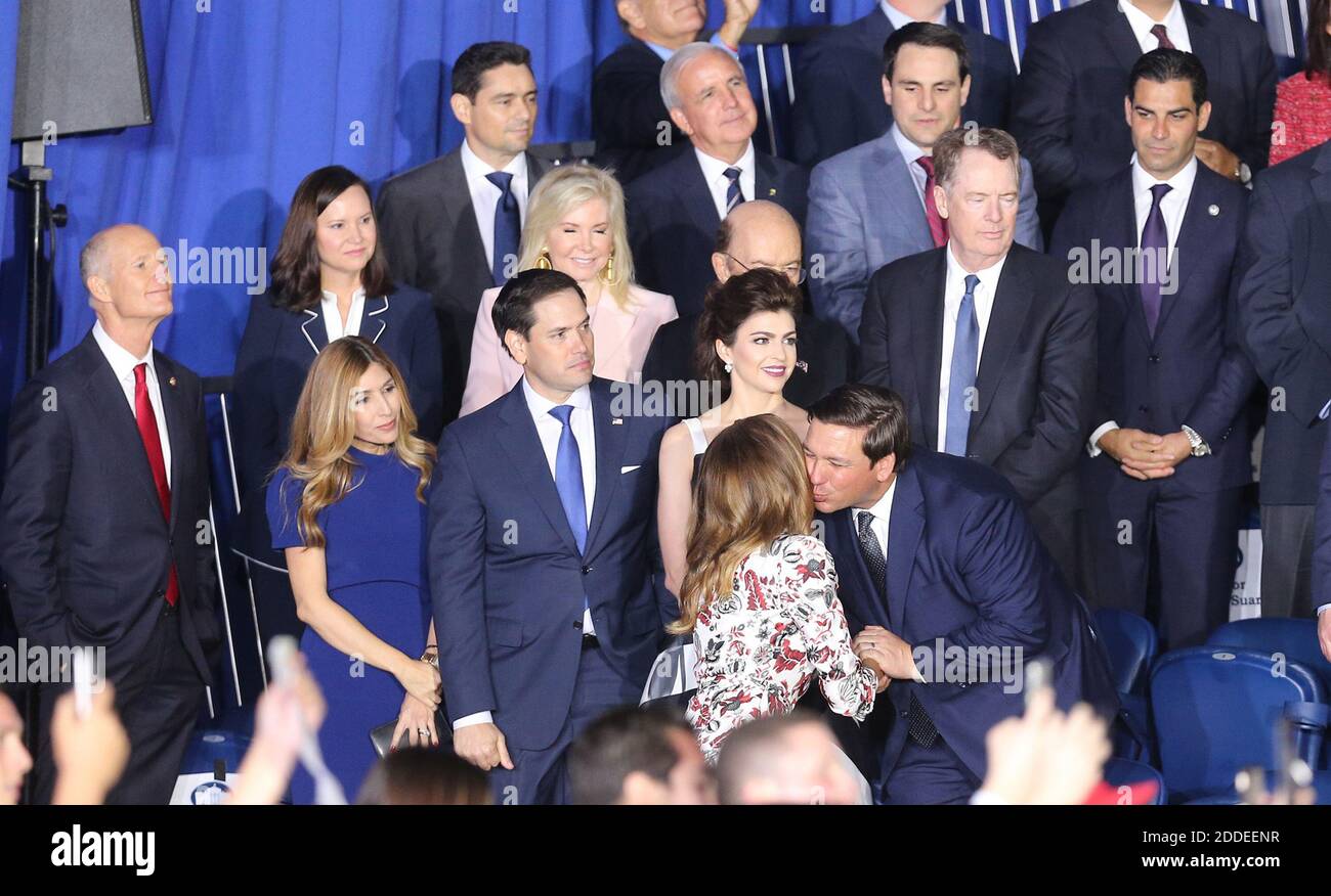 NO FILM, NO VIDEO, NO TV, NO DOCUMENTARY - First lady Melania Trump kisses  Florida Governor Ron DeSantis as he is surrounded by local and state  politicians before U.S. President Donald Trump