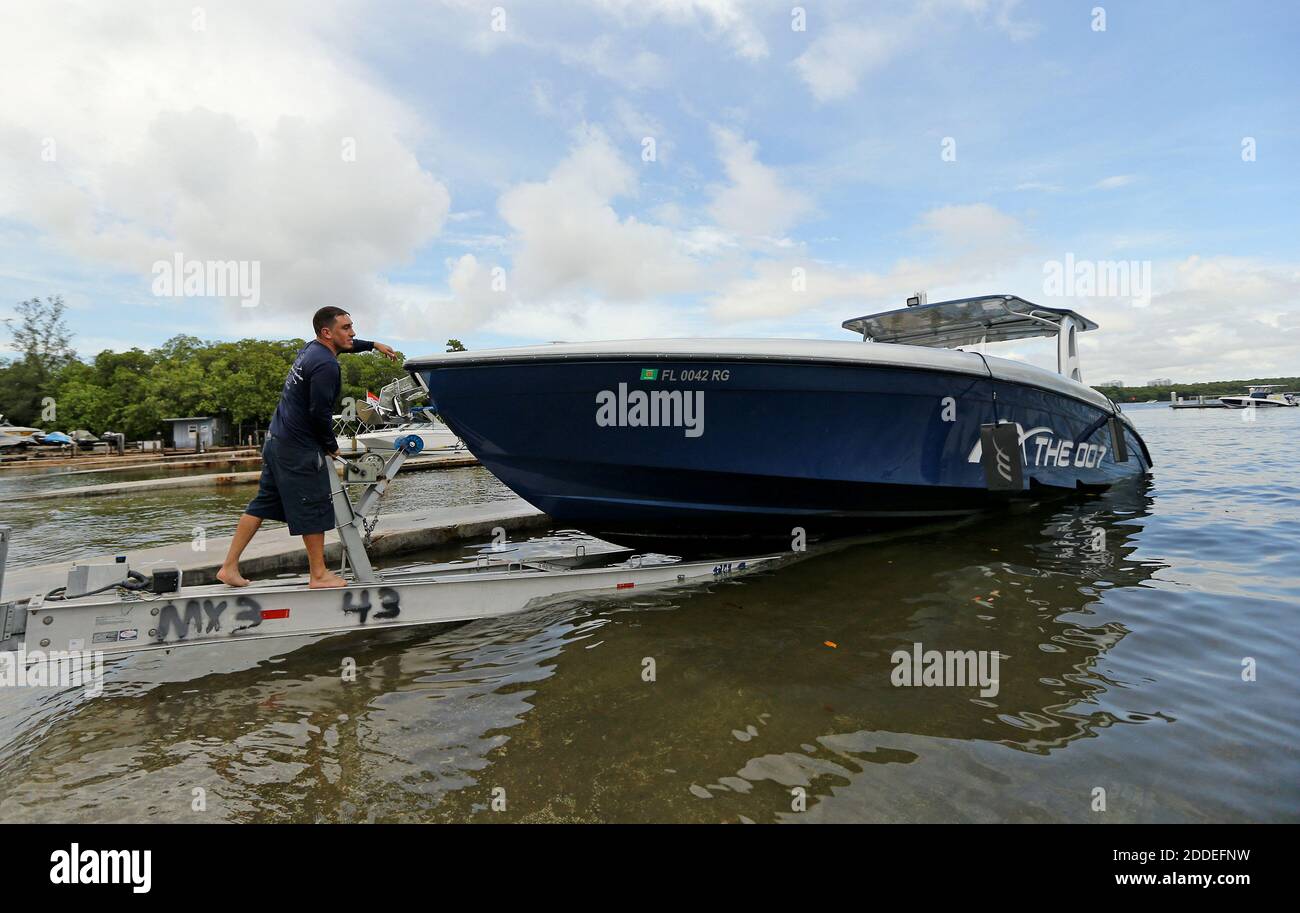 NO FILM, NO VIDEO, NO TV, NO DOCUMENTARY - Midnight Express Powerboats  employee Ray Vazquez pull out his boat from the Haulover Marine Center on  Friday, August 30, 2019 in Miami Beach