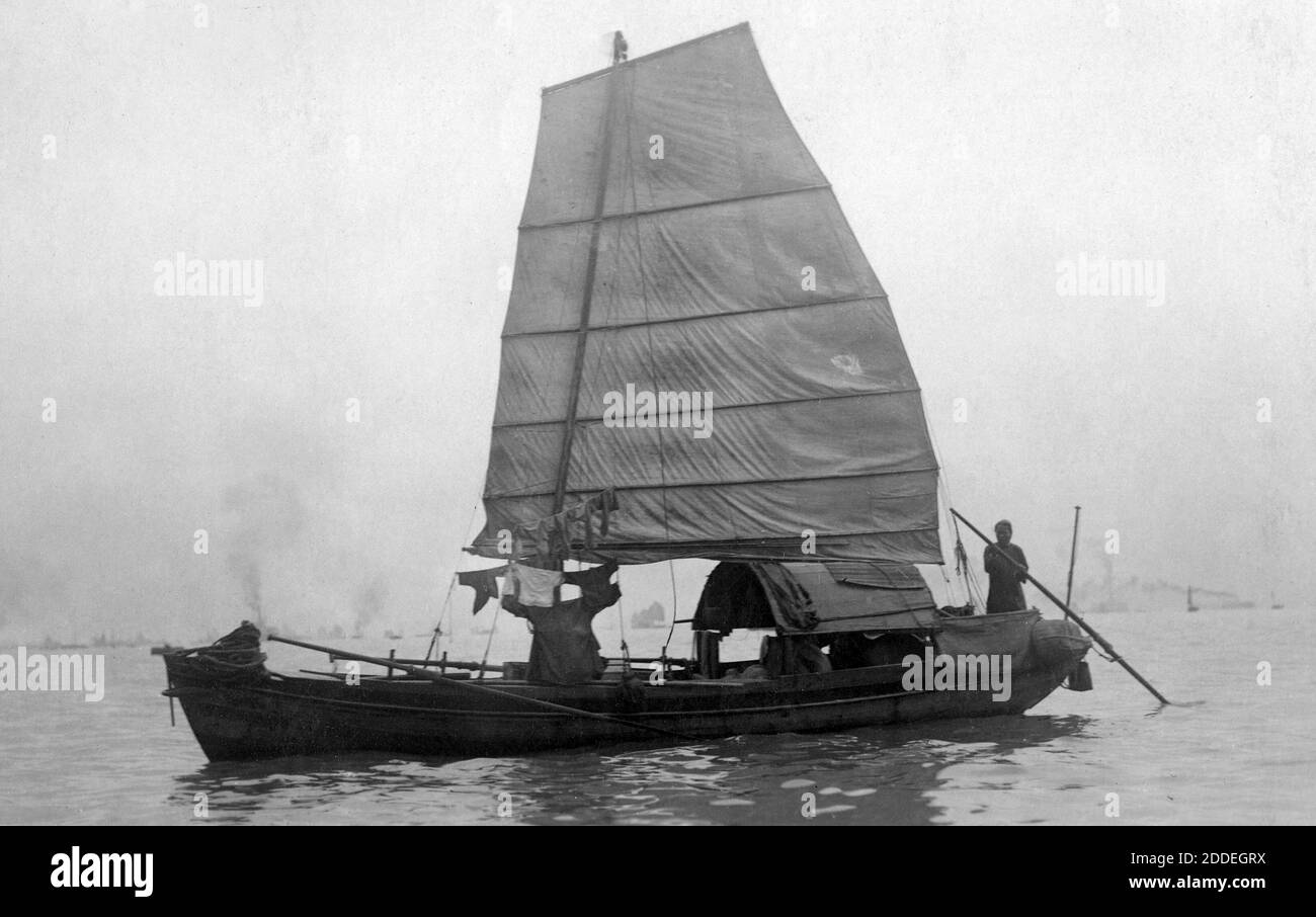 AJAXNETPHOTO. 1920. LOCATION UNKNOWN. (POSSIBLY SHANGHAI.) - JUNK RIGGED WOODEN HULLED SAILING SAMPAN TYPICAL OF ASIAN WORKBOATS. PHOTOGRAPHER:UNKNOWN © DIGITAL IMAGE COPYRIGHT AJAX VINTAGE PICTURE LIBRARY SOURCE: AJAX VINTAGE PICTURE LIBRARY COLLECTION REF:1920 6 Stock Photo