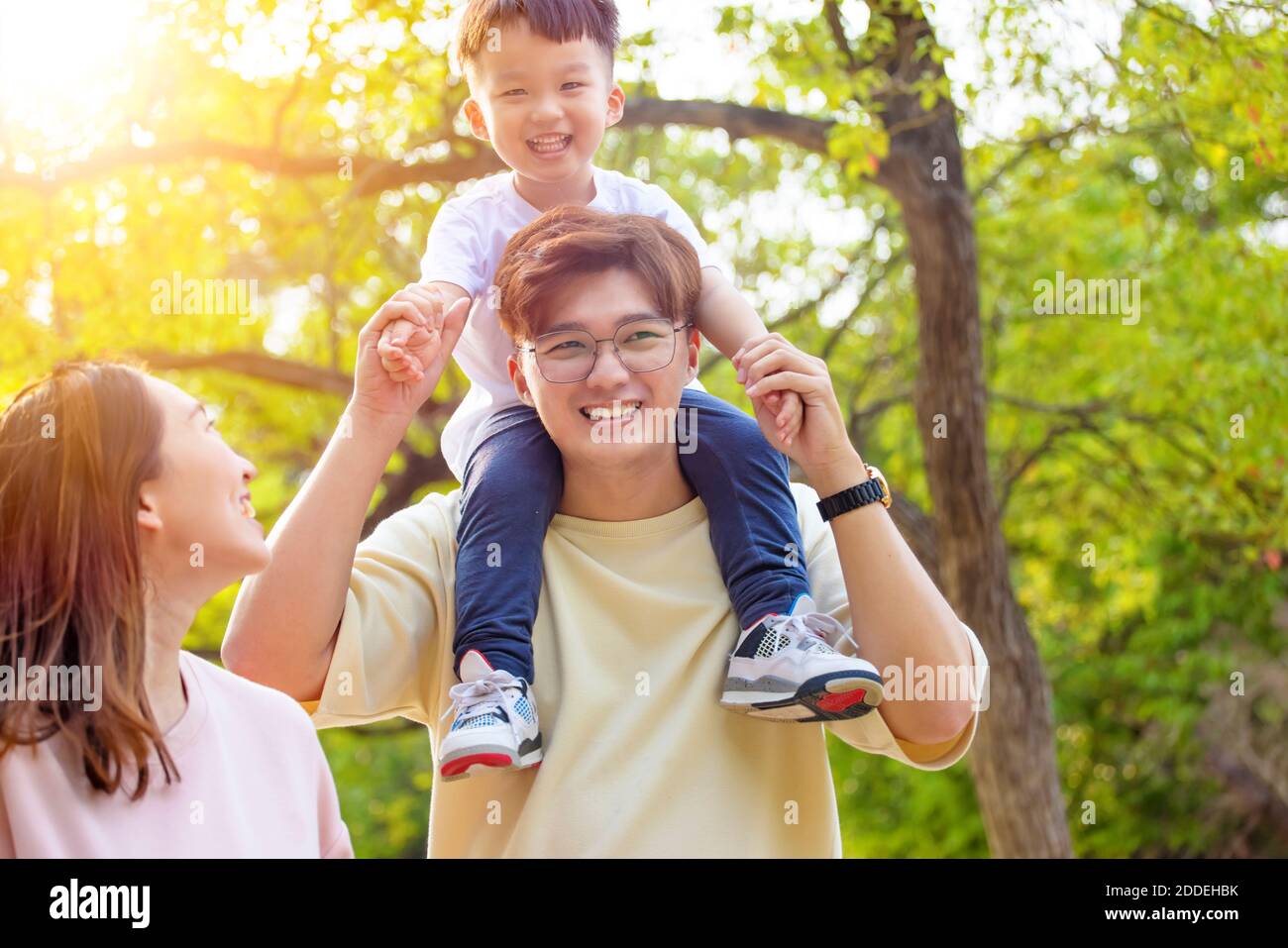 happy family walking in the park Stock Photo