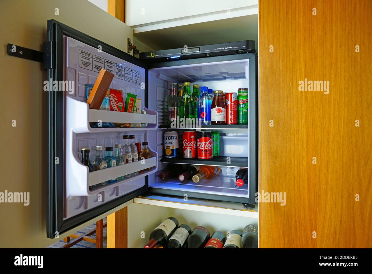 WASHINGTON, DC -22 FEB 2020- View of a minibar filled with miniature small bottles with the door open at the Park Hyatt Washington. Stock Photo