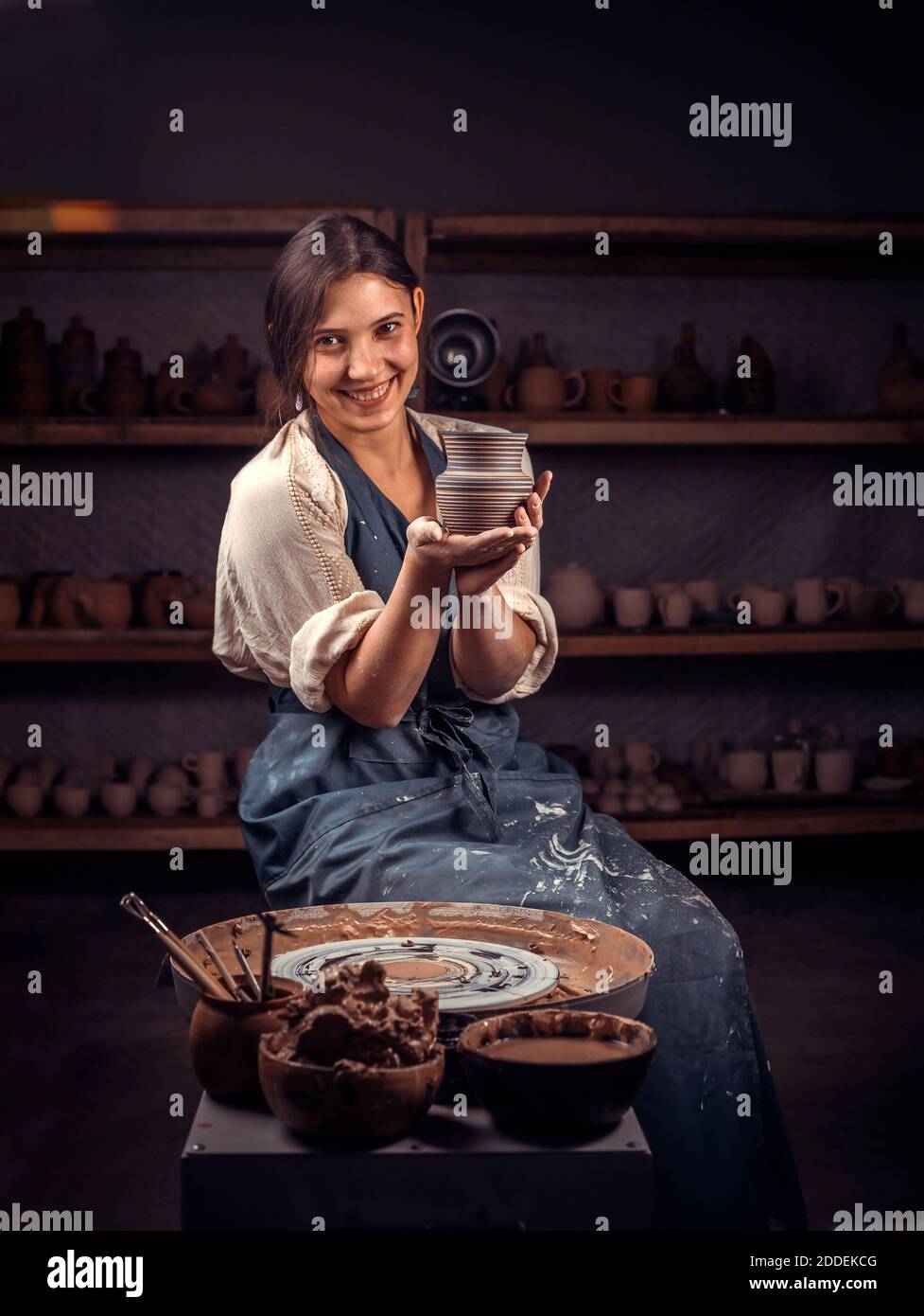 Stylishceramist is working on pottery wheel. Manual work Stock Photo