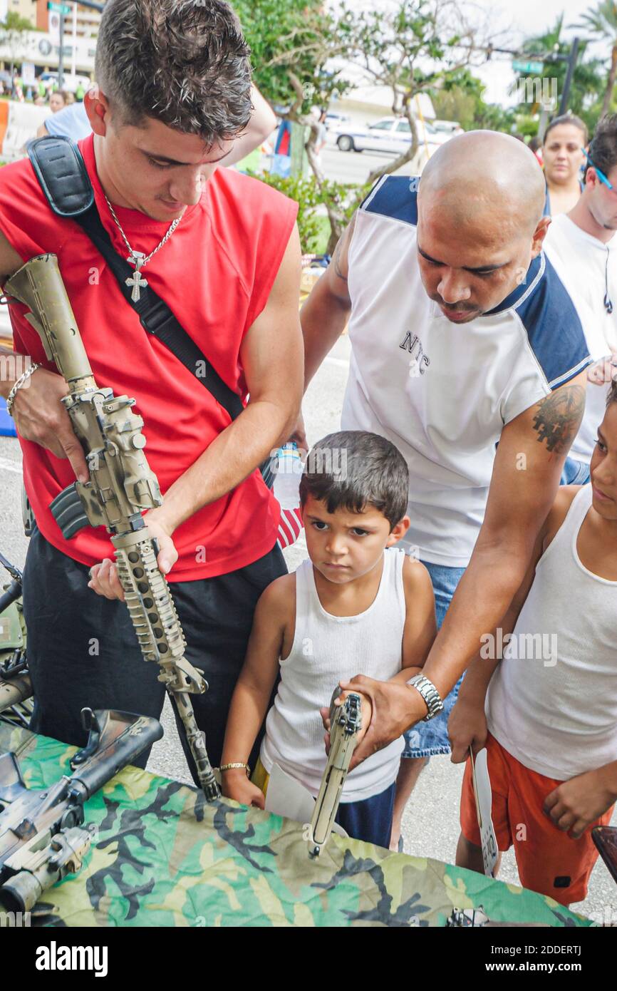Florida Ft. Fort Lauderdale Beach Air & Sea Show,National Guard military weapons guns confiscated Afghanistan,Hispanic teen teenage teenager boy boys Stock Photo