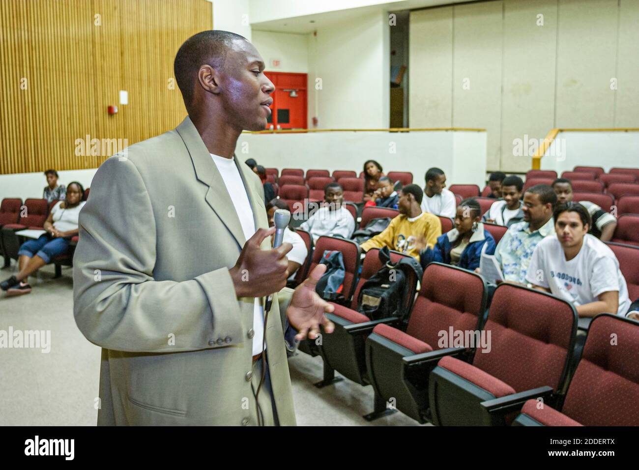 Miami Florida,Little Haiti Miami Edison Senior High School,motivational speaker Patrick Quinn,Black man student students teen teens teenager teenagers Stock Photo