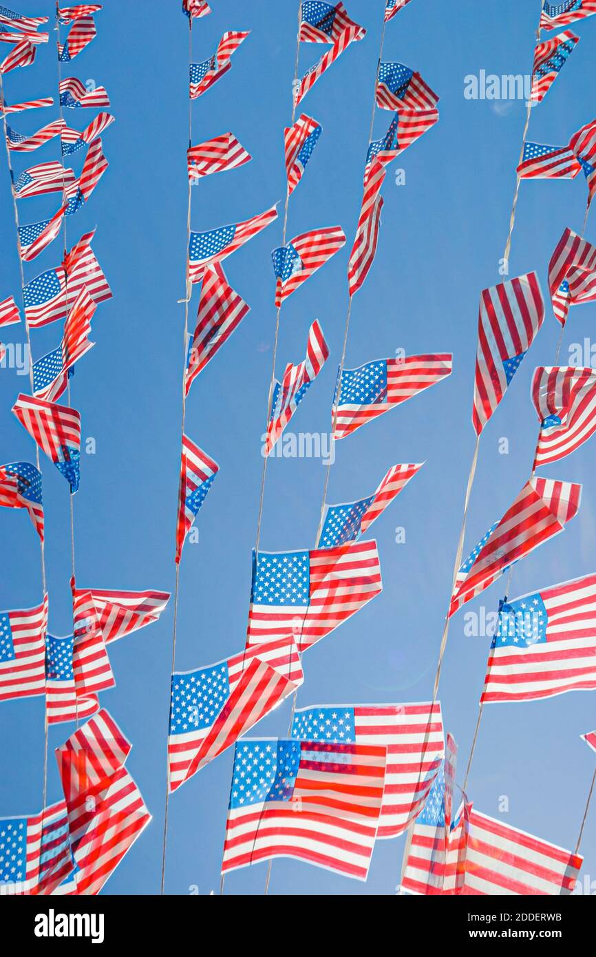 Florida Ft. Fort Lauderdale Las Olas Riverfront,flags banners against blue sky, Stock Photo