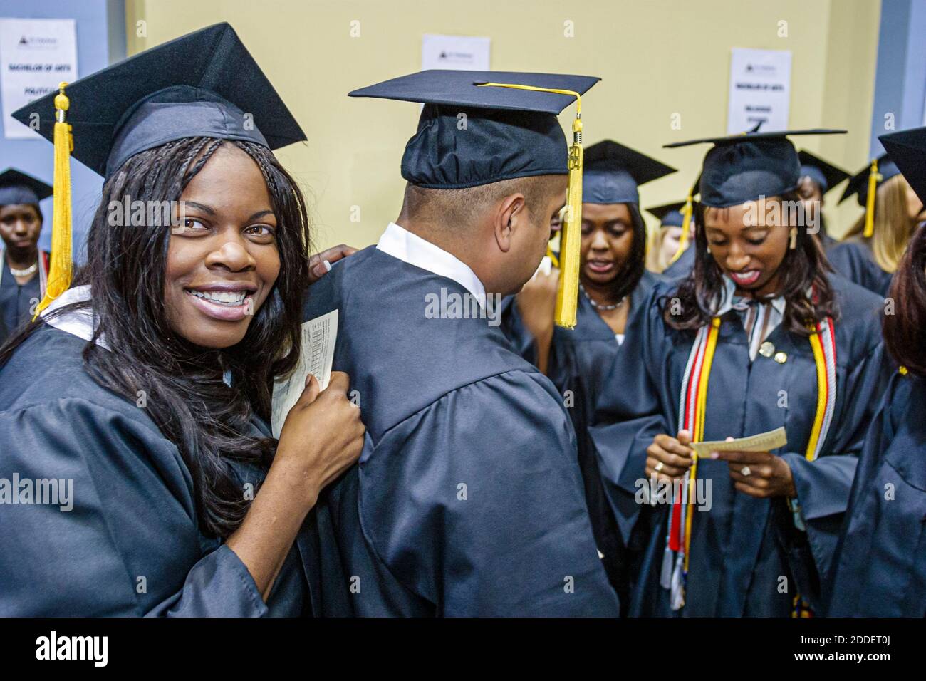 Florida,Miami Beach Convention Center,centre St. Thomas University Commencement,graduation ceremony student students cap gown graduate graduates,Black Stock Photo