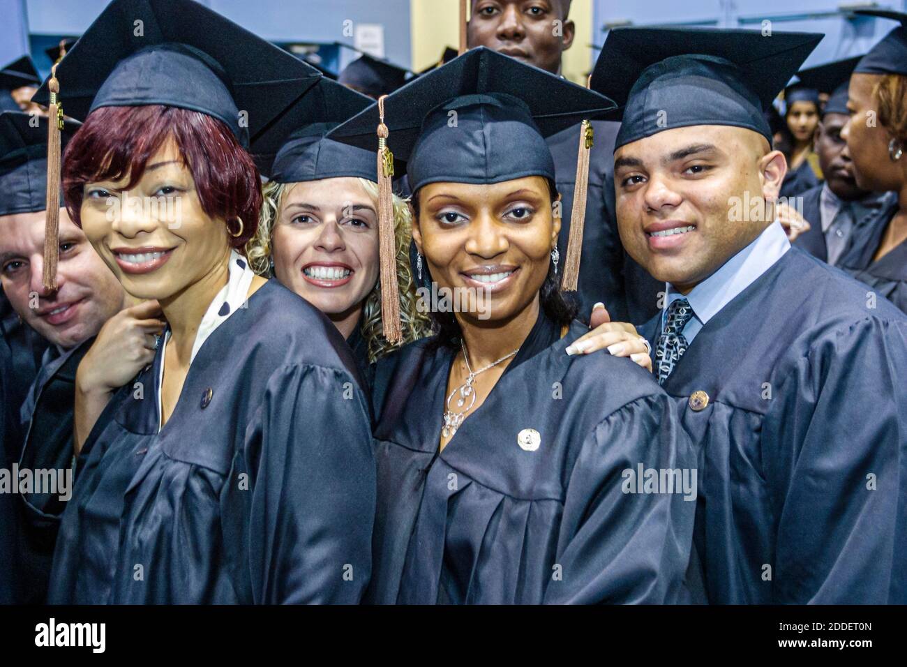 Florida,Miami Beach Convention Center,centre St. Thomas University Commencement,graduation ceremony student students cap gown graduate graduates,Black Stock Photo