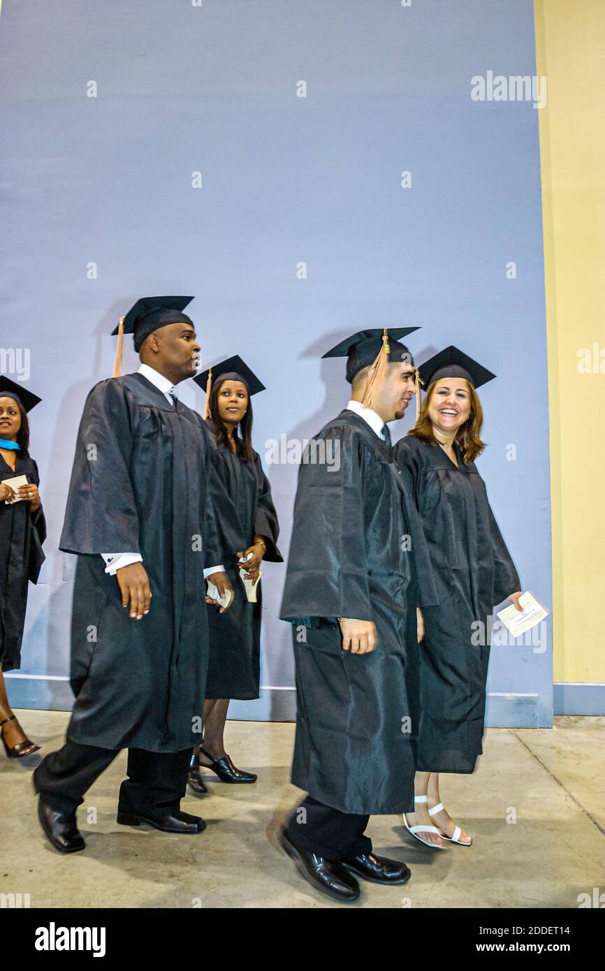 Florida,Miami Beach Convention Center,centre St. Thomas University Commencement,graduation ceremony student students cap gown graduate graduates,Black Stock Photo