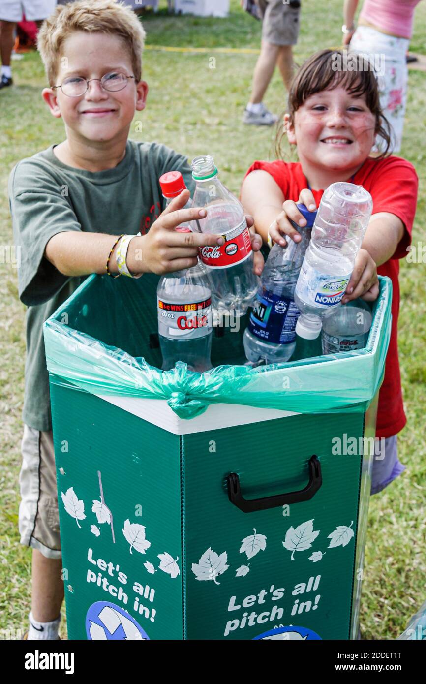 Florida ft fort lauderdale boy girl kids recycle bin hires stock