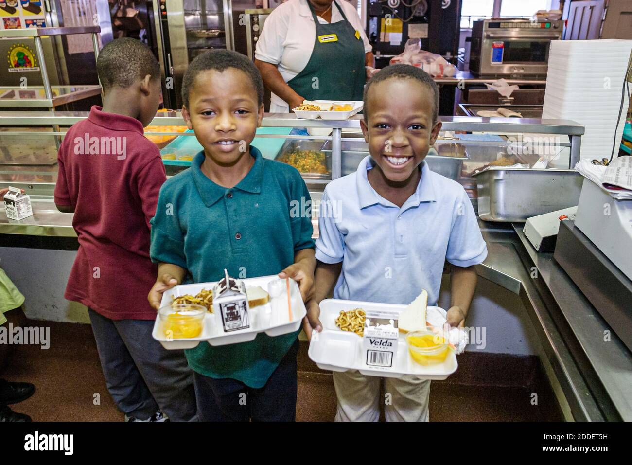 Miami Florida,Little Haiti Edison Park Elementary School,student students Black boys friends cafeteria lunch tray, Stock Photo