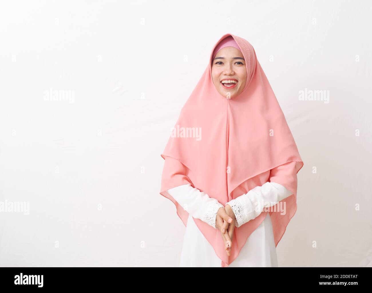 A portrait of happy asian muslim woman wearing a veil or hijab smiling ...