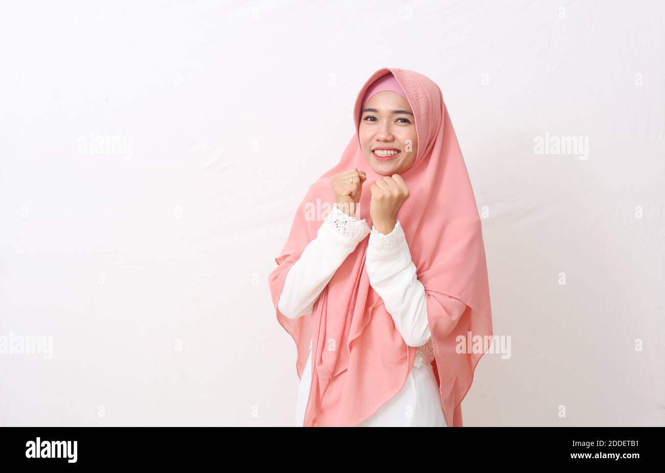 A portrait of happy asian muslim woman wearing a veil or hijab smiling ...