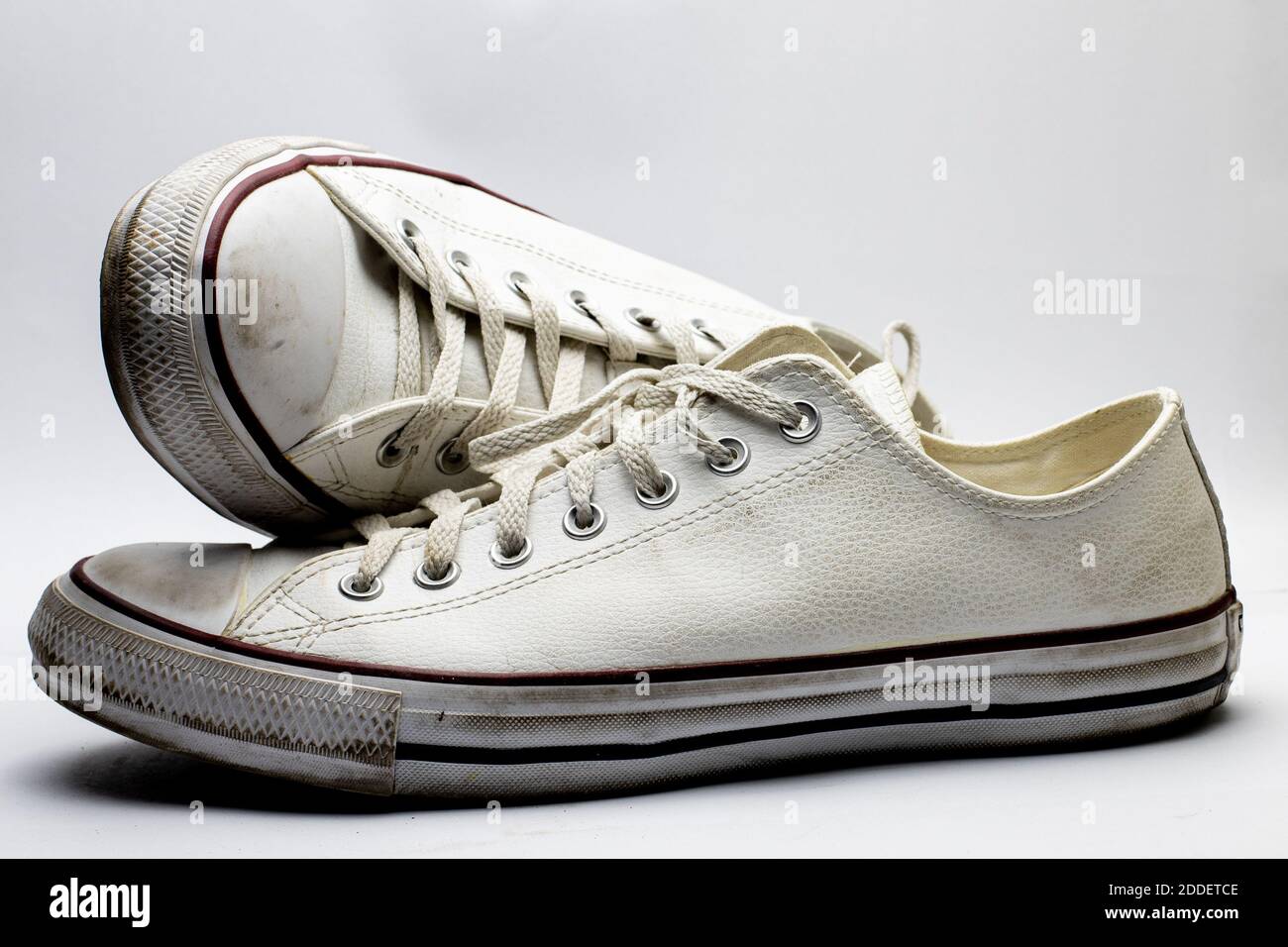 Old dirty sneakers worn out by years of use Stock Photo - Alamy