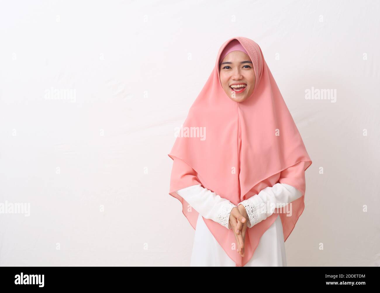 A portrait of happy asian muslim woman wearing a veil or hijab smiling ...