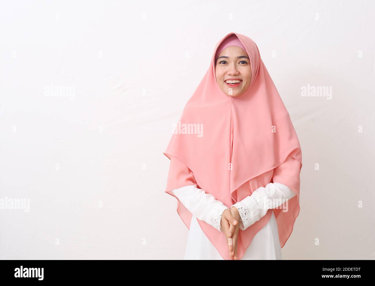A portrait of happy asian muslim woman wearing a veil or hijab smiling ...