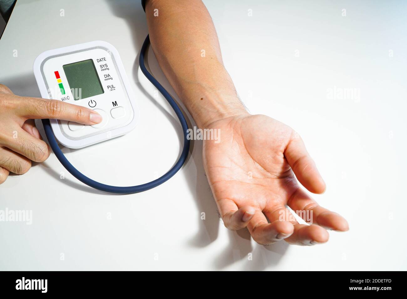 Blood pressure check test monitor exam. Male hand and diagnostic