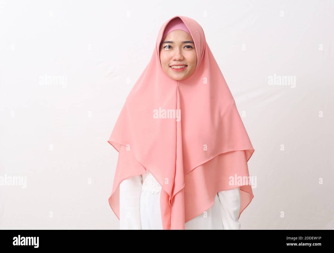 A portrait of happy asian muslim woman wearing a veil or hijab smiling ...