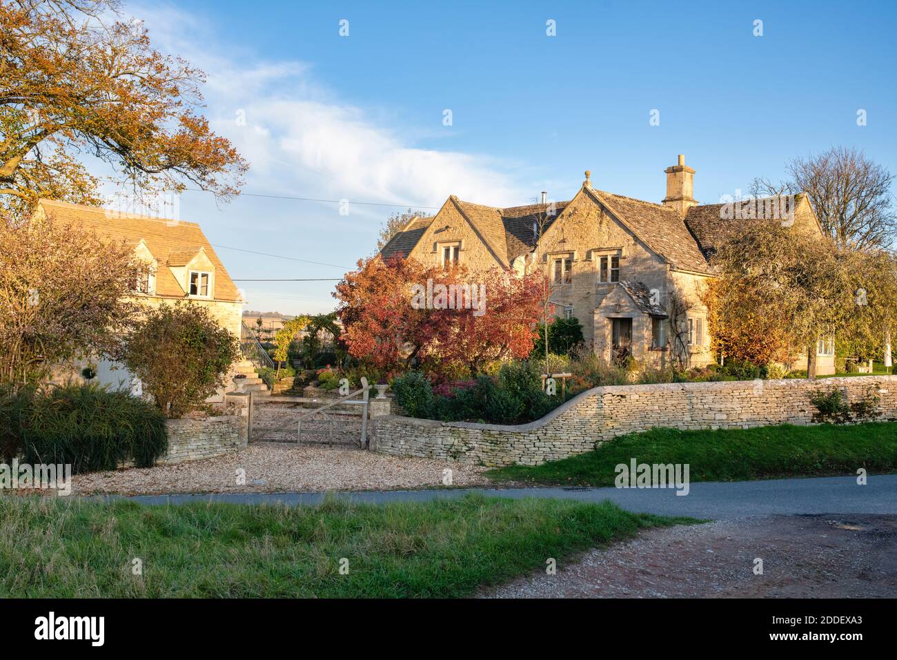 Cotswold stone house in autumn afternoon sunlight in the village of