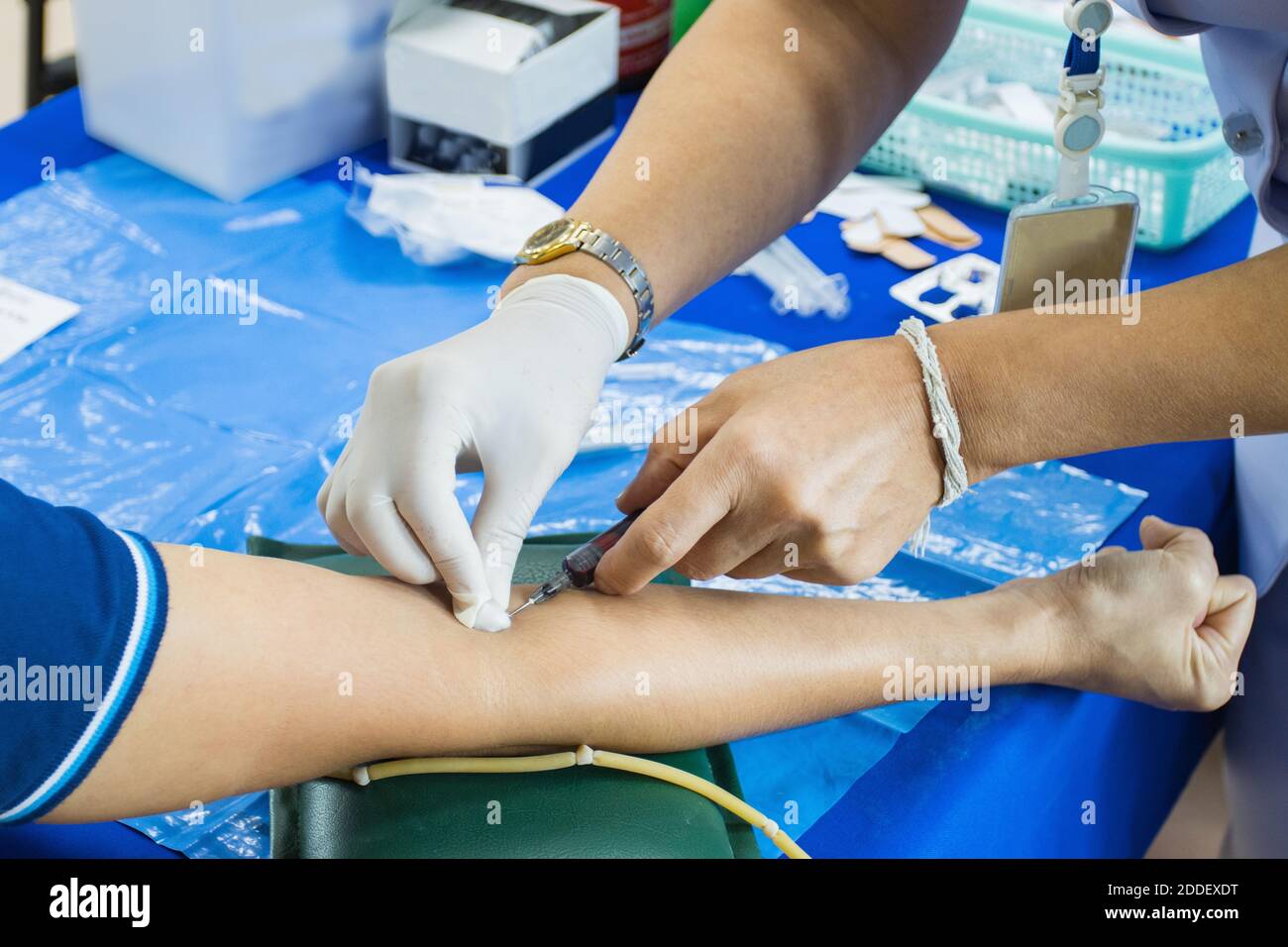 doctor injection needle on arm to collect blood for test the health selective focus syringe