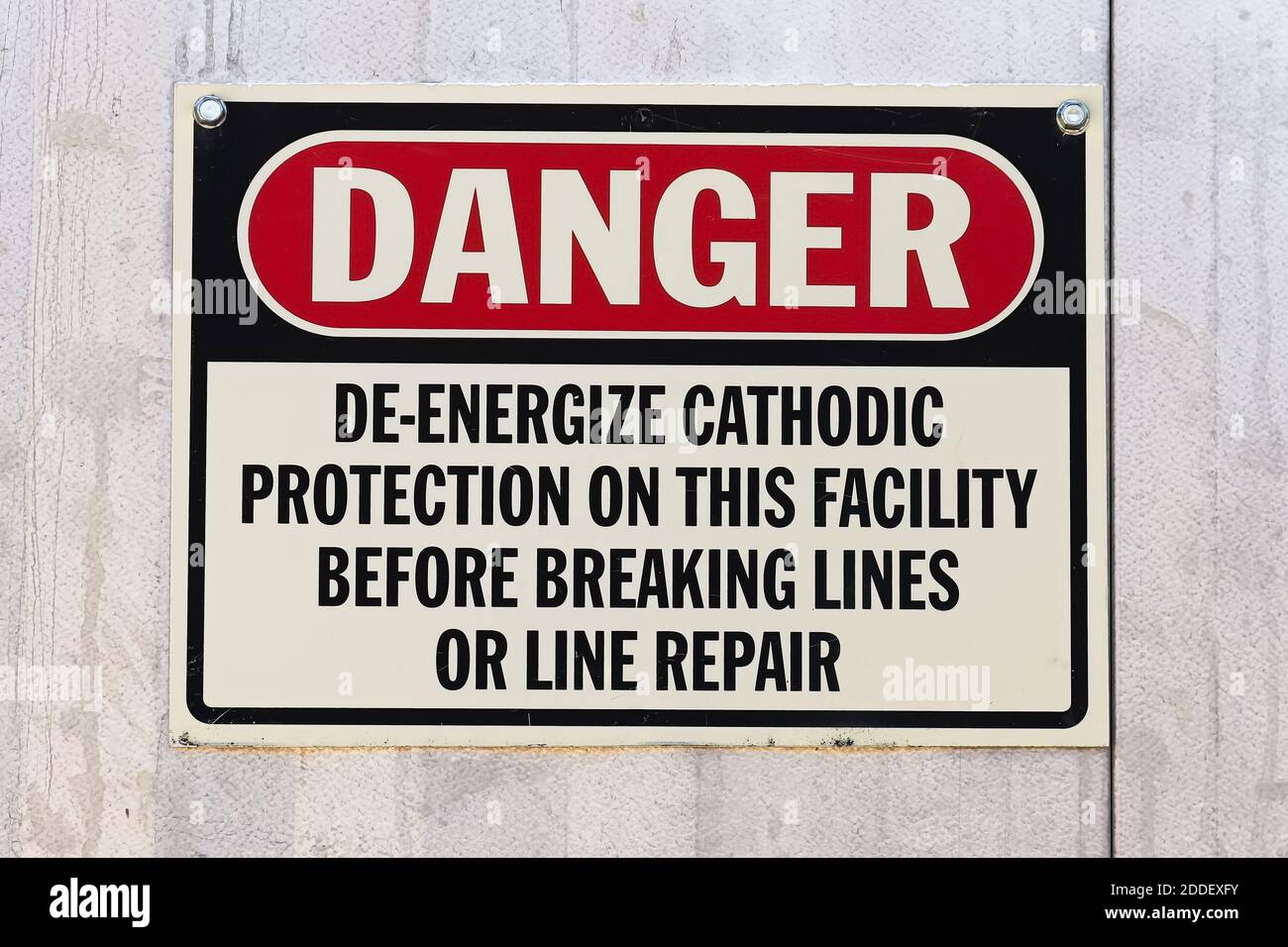 A Danger Deenergize Cathodic Protection at this Facility sign Stock Photo