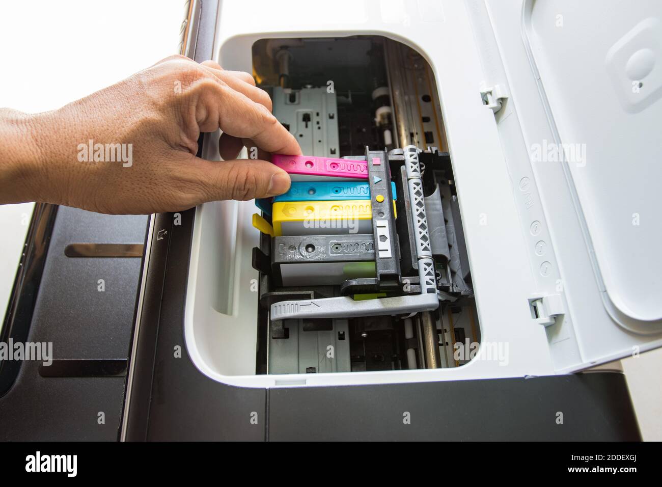Technicians are install setup the ink cartridge of a inkjet printer the
