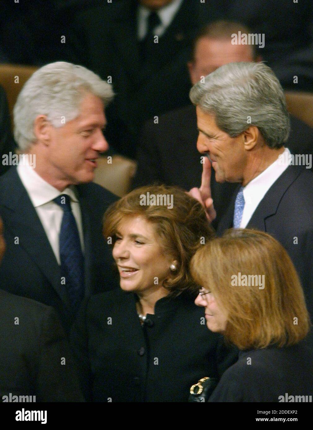 The presumptive Democratic nominee for president, United States Senator John Kerry (Democrat of Massachusetts), left, seemingly shares a secret with former US President Bill Clinton, left at Ronald Reagan's funeral at the Washington National Cathedral in Washington, D.C. on June 11, 2004.  Kerry's wife, Theresa Heinz Kerry, is in the foreground at center.Credit: Ron Sachs / CNP  (RESTRICTION: NO New York or New Jersey Newspapers or newspapers within a 75 mile radius of New York City) /MediaPunch Stock Photo