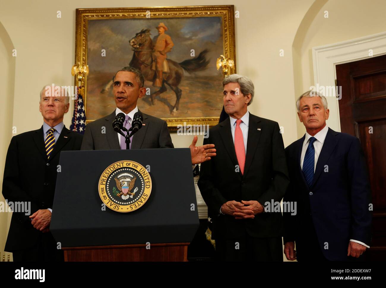 United States President Barack Obama (C) delivers a statement on the legislation he sent to Congress to authorize the use of military force (AUMF) against ISIL, while US Vice President Joe Biden (L) and Secretary of States John Kerry (2R) and Secretary of Defense Chuck Hagel (R) listen, in the Roosevelt Room of the White House, in Washington, DC on February 11, 2015. Credit: Aude Guerrucci / Pool via CNP /MediaPunch Stock Photo