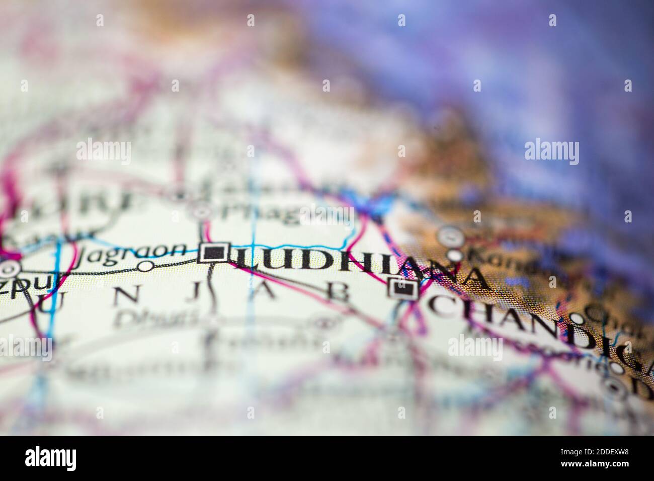 Shallow depth of field focus on geographical map location of Ludhiana India Asia continent on atlas Stock Photo