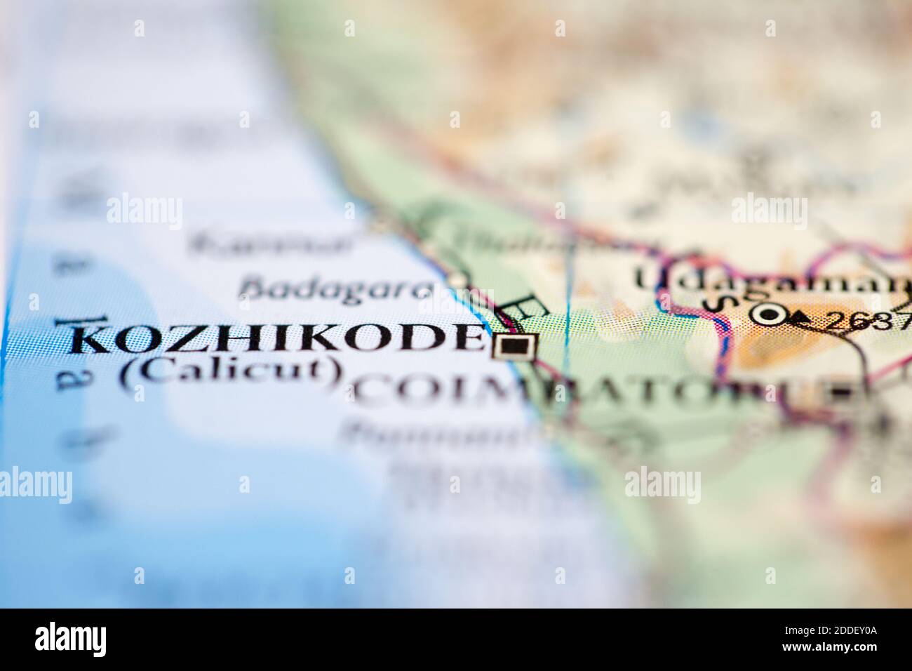 Shallow depth of field focus on geographical map location of Kozhikode Calicut India Asia continent on atlas Stock Photo