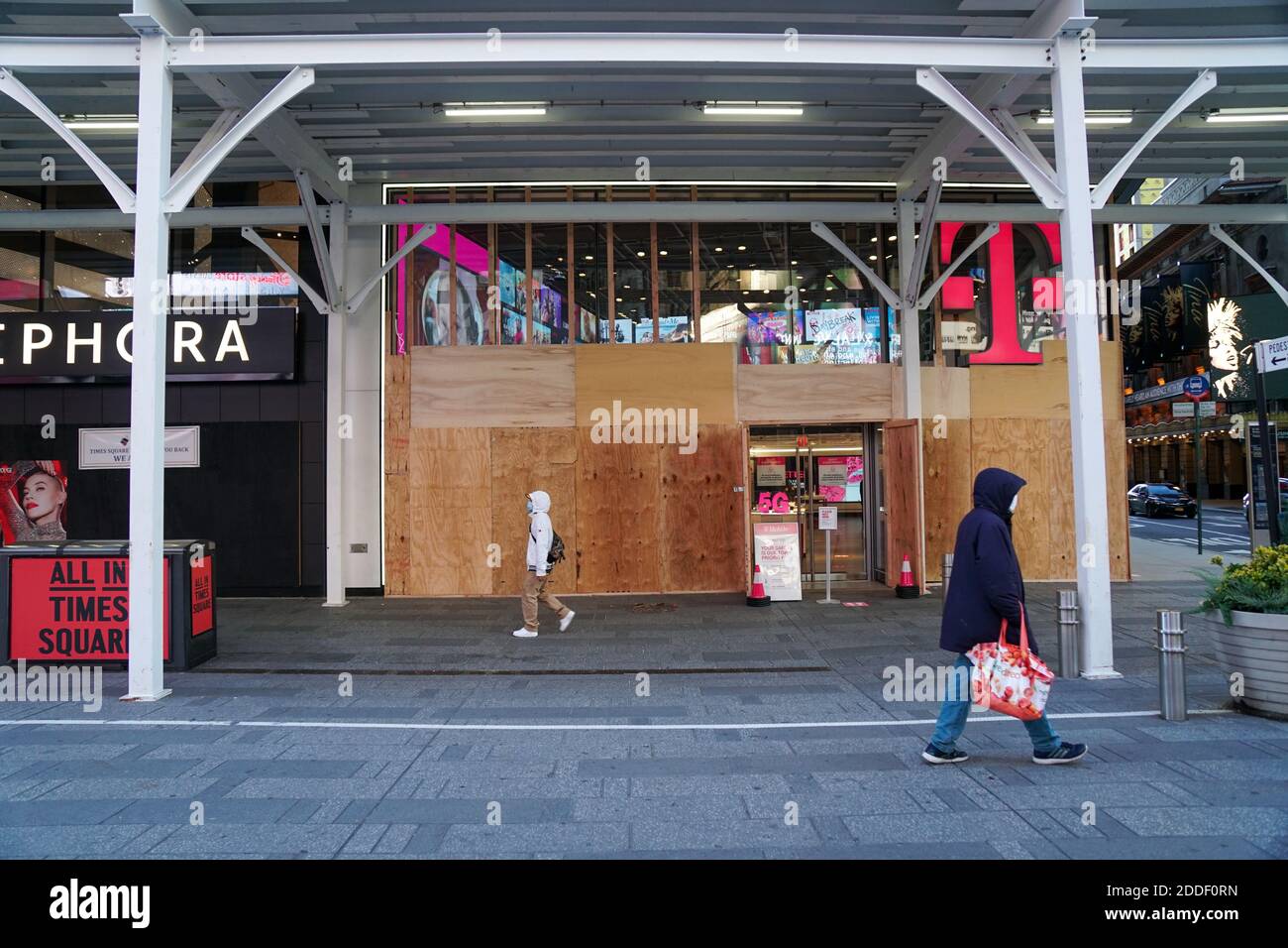 NEW YORK, NY - NOVEMBER 2: T-Mobile store front in Times Square is boarded up in anticipation of looting in response to presidential election results. Stock Photo