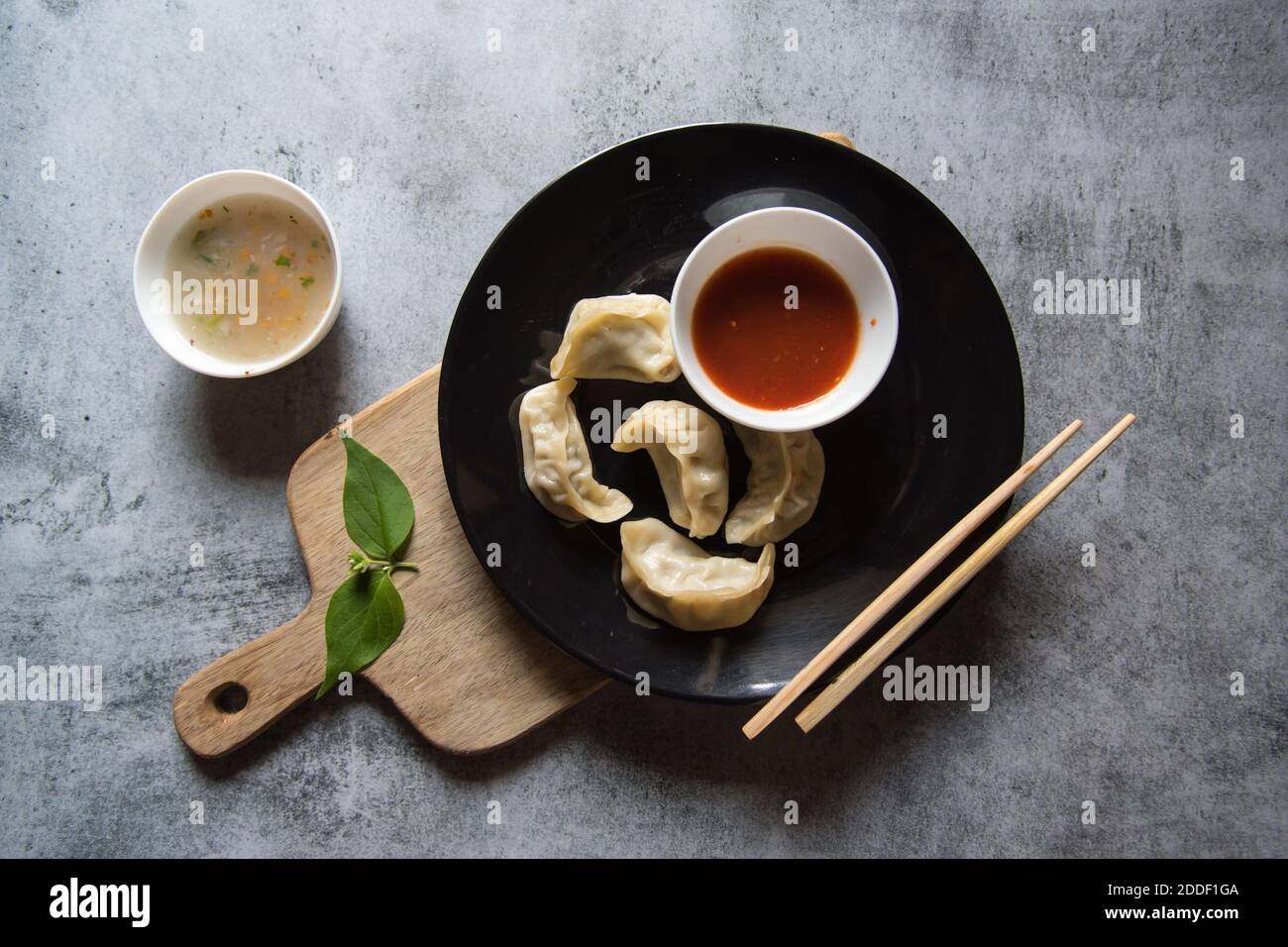 Dim Sum Condiments Dim sums in a plate with condiments Stock Photo - Alamy