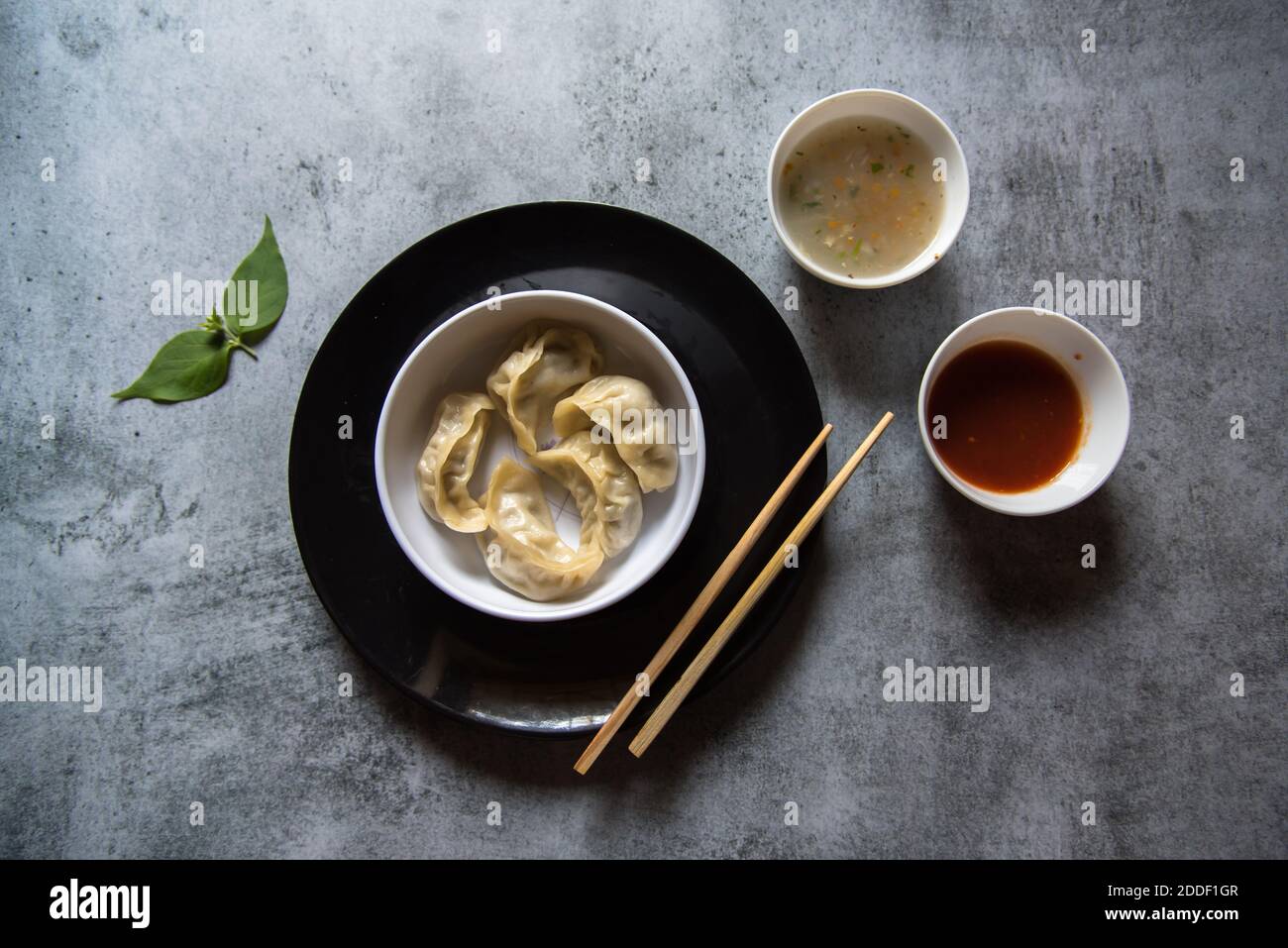 Top view of Dim sums in a plate with condiments Stock Photo - Alamy