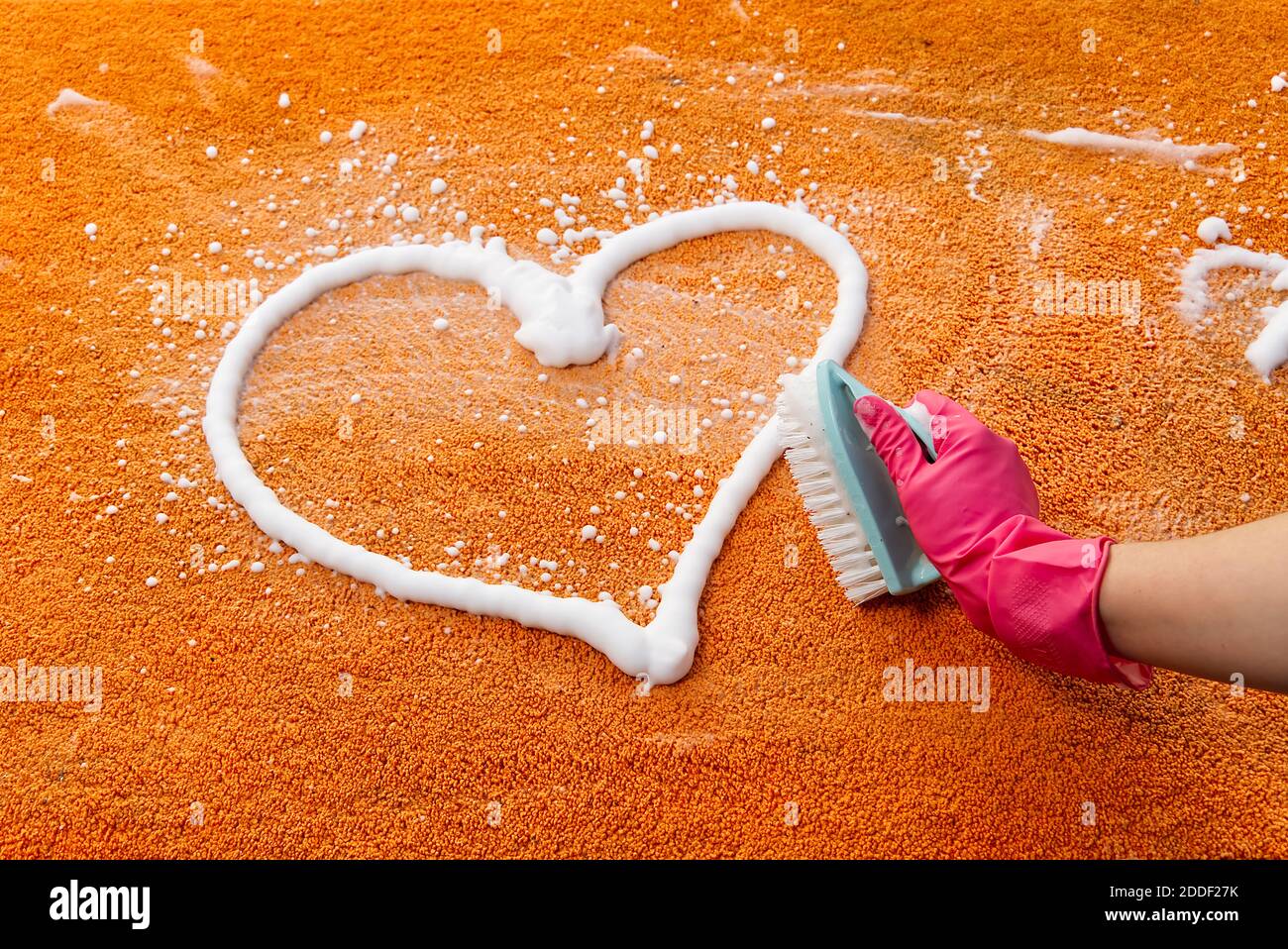 Premium Photo  Woman hand cleaning stain on carpet with hard brush. close  up of orange carpet wet cleaning. carpet cleaning service concept