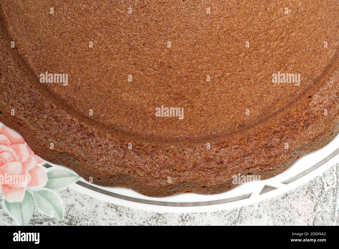 brown textured freshly baked sponge cake crust Stock Photo