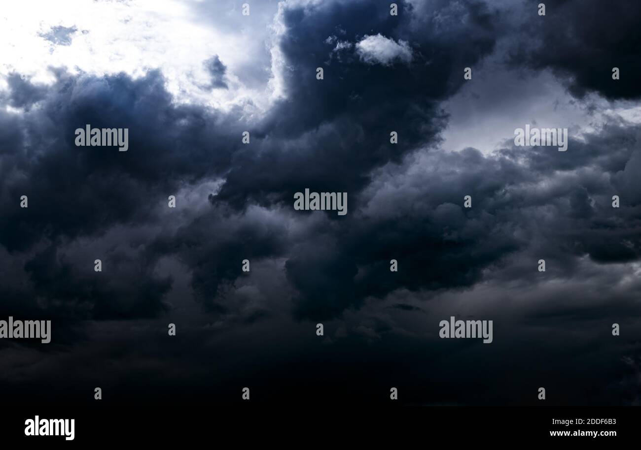 Dark and Dramatic Storm Clouds Area Background Stock Photo