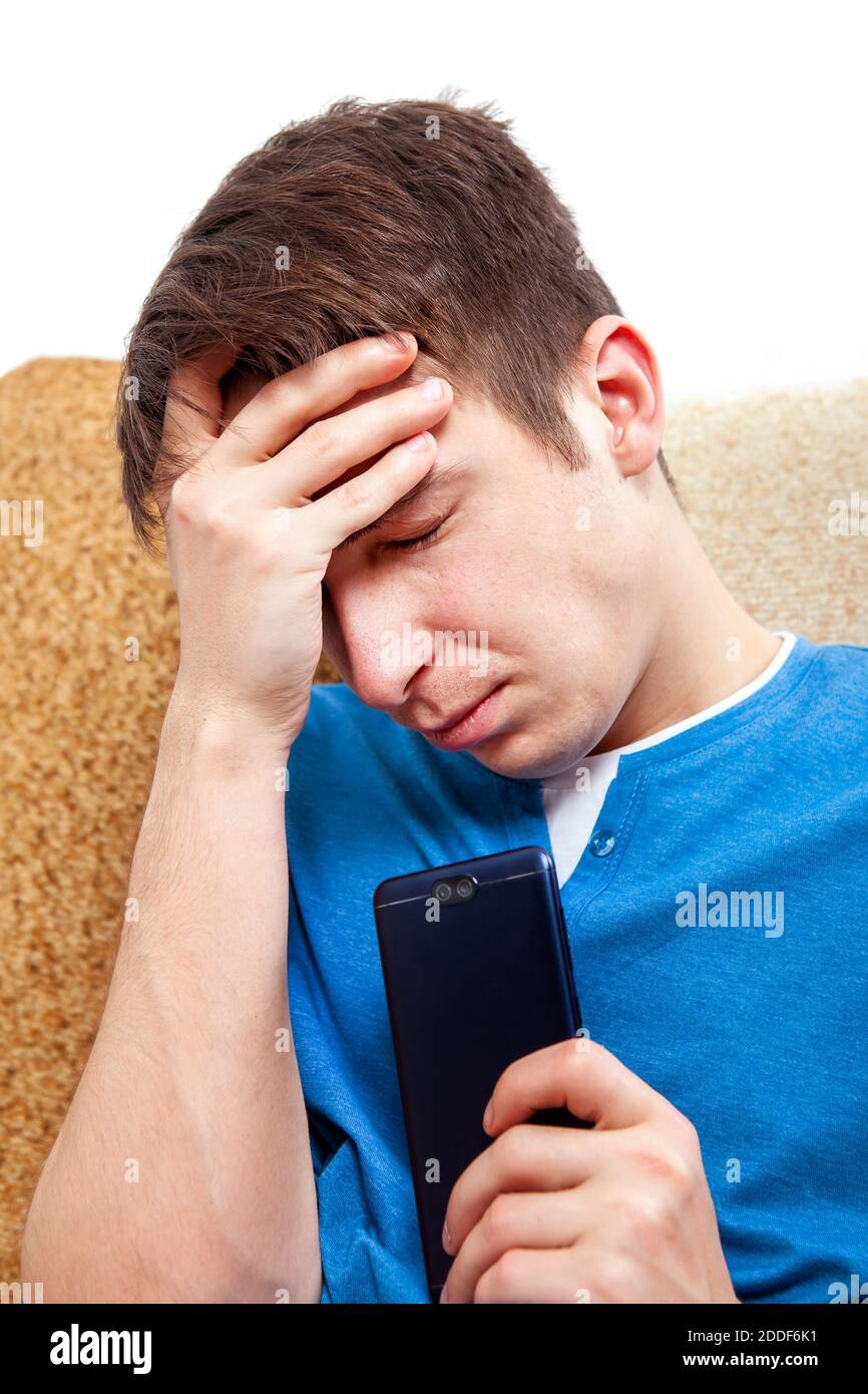 Sad man has bad online chat news and feels disappointed on the smartphone.  Stock Photo by ©sevendeman 506404148