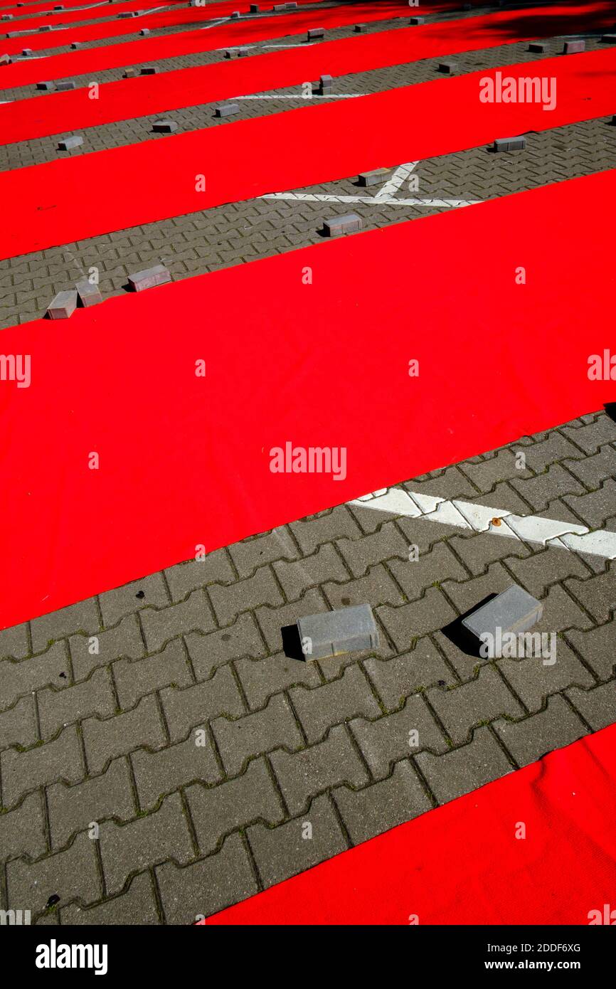 Paved ground with red stripes Stock Photo - Alamy