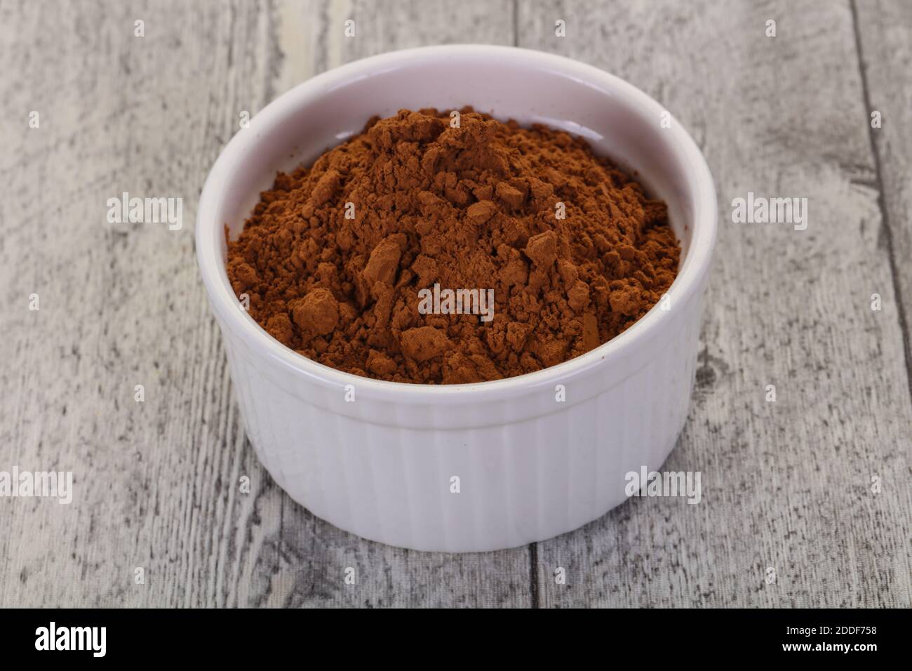 Cocoa powder in the bowl - ready for cooking Stock Photo - Alamy