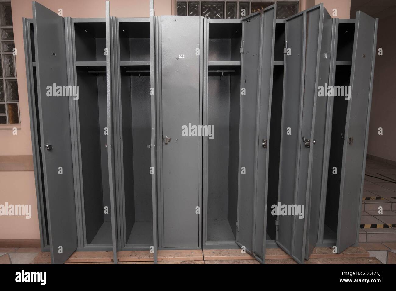 locker room with gray lockers for the employees at the work place Stock