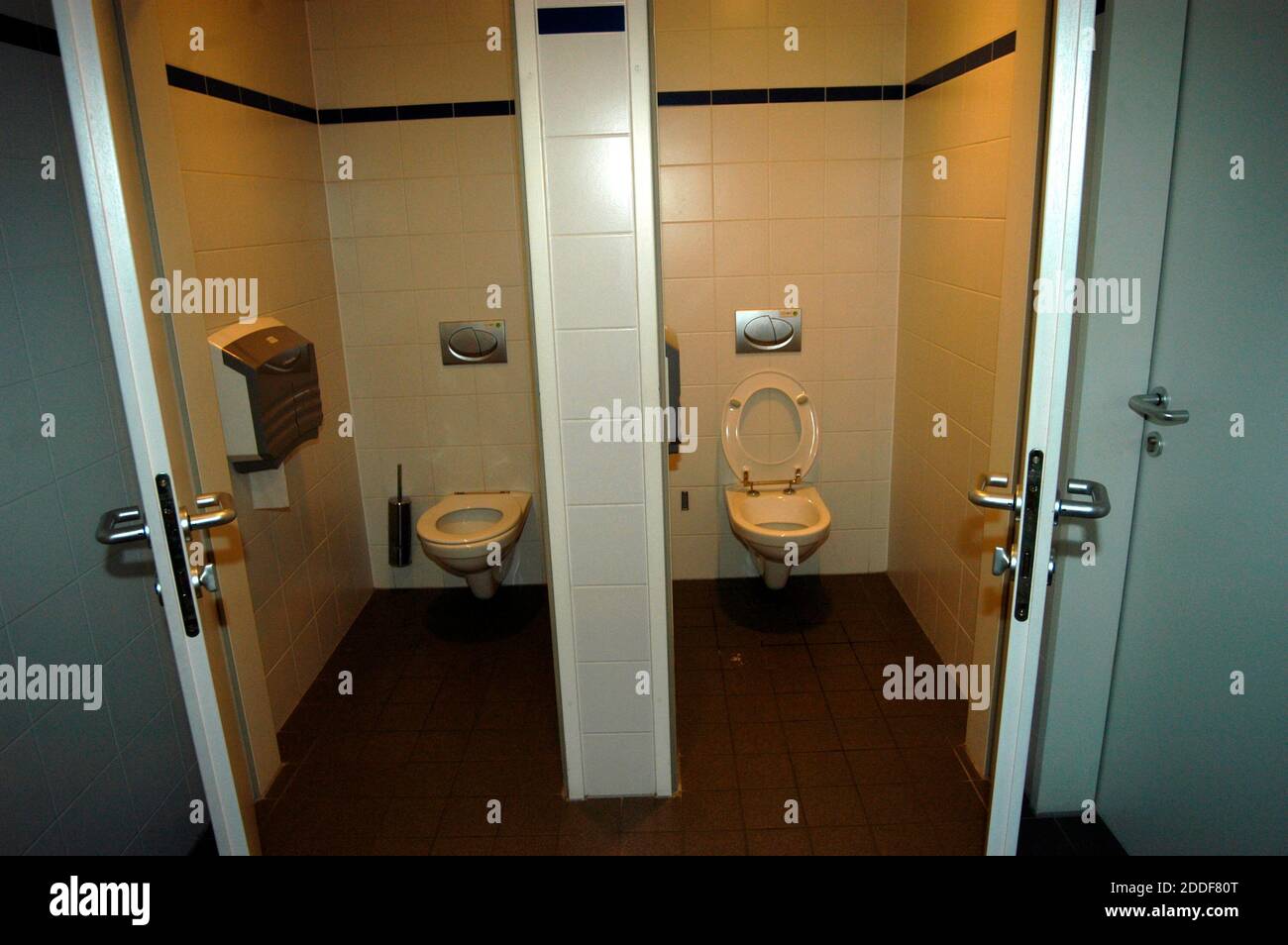 Public toilets with open doors, tiled room with lockable doors Stock Photo Alamy